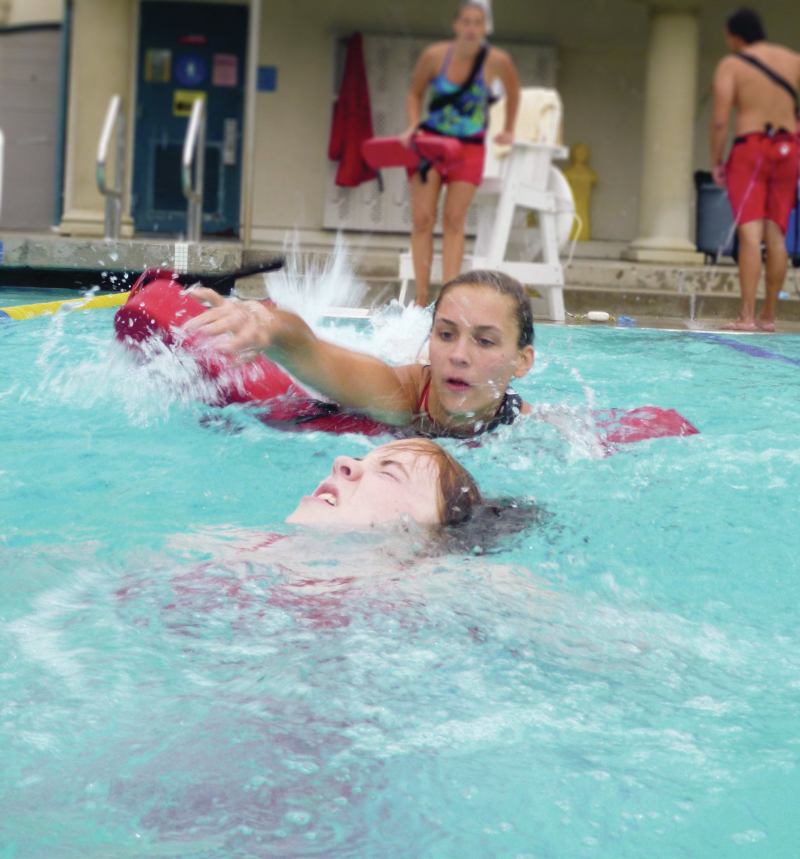 TRAGEDY TRIGGERS LAW As seen here, a lifeguard practices rescue techniques. Maryland recently passed a law requiring defibrillators at all public pools. Debbie Neagle-Freed believes her son, who drowned at a pool in 2006, would be alive today had lifeguards used an AED.