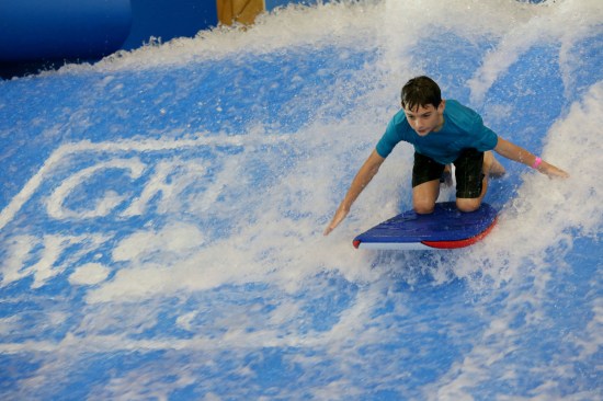 Eleven year-old Southern California resident, Connor Brokowski, surfs on the Wolf Rider Wipeout at the all-new Great Wolf Lodge Southern California resort grand opening.